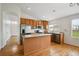 Updated kitchen features stainless steel appliances, a center island, and hardwood floors at 11847 Trail View Ln, Parker, CO 80134