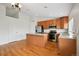 Modern kitchen with stainless steel appliances, center island, and hardwood floors at 11847 Trail View Ln, Parker, CO 80134