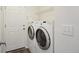 Convenient laundry room equipped with modern washer and dryer units for easy laundry at 11847 Trail View Ln, Parker, CO 80134