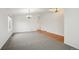 Spacious living room with neutral carpet, hardwood accents, and ample natural light at 11847 Trail View Ln, Parker, CO 80134