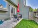 Back patio of home featuring a table, chairs, and an umbrella at 17427 E Rice Cir # C, Aurora, CO 80015