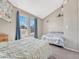 Bedroom with two large windows and two beds, providing ample space and natural light at 17427 E Rice Cir # C, Aurora, CO 80015