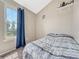 Comfortable bedroom offering a serene ambiance with natural light from the window at 17427 E Rice Cir # C, Aurora, CO 80015