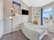 Cozy bedroom with natural light, offering comfort and functionality with a TV at 17427 E Rice Cir # C, Aurora, CO 80015