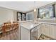 Charming eat-in kitchen features a dining nook with room for a table and bookshelf at 17427 E Rice Cir # C, Aurora, CO 80015