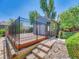 The back of the home features a large deck and decorative fencing at 17427 E Rice Cir # C, Aurora, CO 80015