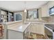 Clean kitchen design with modern countertops, cabinetry and stainless dishwasher at 17427 E Rice Cir # C, Aurora, CO 80015