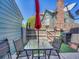Charming backyard patio featuring an umbrella, a table, and an exterior wall at 17427 E Rice Cir # C, Aurora, CO 80015
