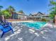 Inviting pool area with lounge chairs, a spacious deck, and views of the surrounding community at 17427 E Rice Cir # C, Aurora, CO 80015