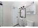 Neat bathroom with a modern vanity, mirror, and convenient cabinet storage space at 757 S Wheeling St, Aurora, CO 80012