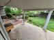 Covered patio with outdoor dining and a spacious backyard for entertaining guests or relaxing in the fresh air at 1962 S Ivory Way, Aurora, CO 80013