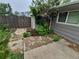 Side yard with a wooden fence and patio providing an intimate setting for relaxation or outdoor entertaining at 1962 S Ivory Way, Aurora, CO 80013