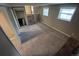 Finished basement featuring a staircase, carpet, finished walls, and access to multiple rooms at 1962 S Ivory Way, Aurora, CO 80013