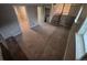 Basement space featuring carpet, finished walls, access to other rooms, and a staircase at 1962 S Ivory Way, Aurora, CO 80013