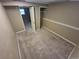 Basement with carpet and entry to a storage space and additional rooms at 1962 S Ivory Way, Aurora, CO 80013