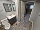 Tiled bathroom features stall shower with glass door, toilet, and sink, and small closet at 1962 S Ivory Way, Aurora, CO 80013