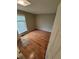 Hardwood floors in bedroom with window and neutral paint at 1962 S Ivory Way, Aurora, CO 80013