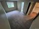 Bedroom with neutral carpeting and view of bathroom at 1962 S Ivory Way, Aurora, CO 80013