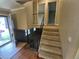 Foyer with stairs leading upstairs and doorway to the left leading to front door at 1962 S Ivory Way, Aurora, CO 80013