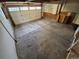 Unfinished garage with concrete flooring, storage cabinet, and a large garage door at 1962 S Ivory Way, Aurora, CO 80013