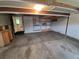 Spacious garage with overhead lighting, built-in shelving, and storage cabinets at 1962 S Ivory Way, Aurora, CO 80013