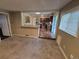 Open concept living room with a kitchen pass-through, seamlessly connecting living spaces at 1962 S Ivory Way, Aurora, CO 80013