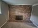 Living room featuring a classic brick fireplace and comfortable carpet at 1962 S Ivory Way, Aurora, CO 80013