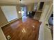 Bright living room featuring hardwood floors and an open staircase, creating an inviting space at 1962 S Ivory Way, Aurora, CO 80013