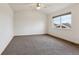 Spacious bedroom filled with natural light from the large window at 11642 Moline Ct, Commerce City, CO 80640