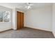 Cozy bedroom with a double door closet and a window at 11642 Moline Ct, Commerce City, CO 80640