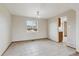 Dining room featuring tile floors, neutral walls, and an ornate light fixture at 11642 Moline Ct, Commerce City, CO 80640