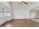 Bright living room featuring hardwood floors, neutral walls, and a bay window at 11642 Moline Ct, Commerce City, CO 80640