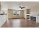 Spacious living area with hardwood floors, fireplace, and great natural light at 11642 Moline Ct, Commerce City, CO 80640