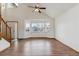 Bright living room featuring hardwood floors, neutral walls, and a bay window at 11642 Moline Ct, Commerce City, CO 80640