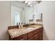 Bathroom vanity featuring granite countertops, sleek hardware, and ample storage space at 10251 W 44Th Ave # 8-102, Wheat Ridge, CO 80033