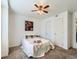 Bright bedroom boasts plush carpet, a ceiling fan, and convenient access to closet space at 10251 W 44Th Ave # 8-102, Wheat Ridge, CO 80033
