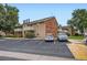 Well-kept condo exterior with balconies and ample parking, enhancing convenience for residents and guests at 10251 W 44Th Ave # 8-102, Wheat Ridge, CO 80033