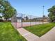 Well-maintained community tennis court surrounded by lush greenery, inviting residents for recreation at 10251 W 44Th Ave # 8-102, Wheat Ridge, CO 80033