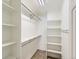 Spacious walk-in closet with built-in shelving provides ample storage and organization at 10251 W 44Th Ave # 8-102, Wheat Ridge, CO 80033