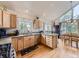 Bright kitchen features wood cabinets, granite countertops, stainless appliances, and a large window at 11526 Green Cir, Conifer, CO 80433