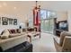 Spacious living room with high ceilings, large windows with great view, cozy fireplace, and comfortable seating at 11526 Green Cir, Conifer, CO 80433