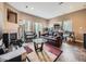 Large living room with a couch, fireplace, windows, and an arcade game at 11526 Green Cir, Conifer, CO 80433