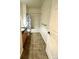 A bathroom with a shower/tub combo, granite vanity, and tile floor at 17346 Nature Walk Trail # 105, Parker, CO 80134