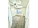 A carpeted bedroom with a large window and ceiling fan at 17346 Nature Walk Trail # 105, Parker, CO 80134