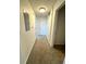 A long hallway with carpeted floors and neutral-colored walls at 17346 Nature Walk Trail # 105, Parker, CO 80134