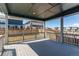 Outdoor view of porch with wood-style railings, a nice deck and blue-sky views at 20936 E 61St Ave, Aurora, CO 80019