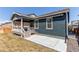 A patio and covered porch are featured in this home's fully fenced backyard at 20936 E 61St Ave, Aurora, CO 80019