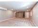 Spacious carpeted basement providing ample room for various activities with a stairway leading up to the house at 20936 E 61St Ave, Aurora, CO 80019