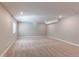 Expansive carpeted basement with recessed lighting, offering a versatile space for recreation or storage at 20936 E 61St Ave, Aurora, CO 80019