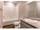 Clean bathroom with a shower-tub combo, wood look floors, a modern vanity, and an oval sink at 20936 E 61St Ave, Aurora, CO 80019
